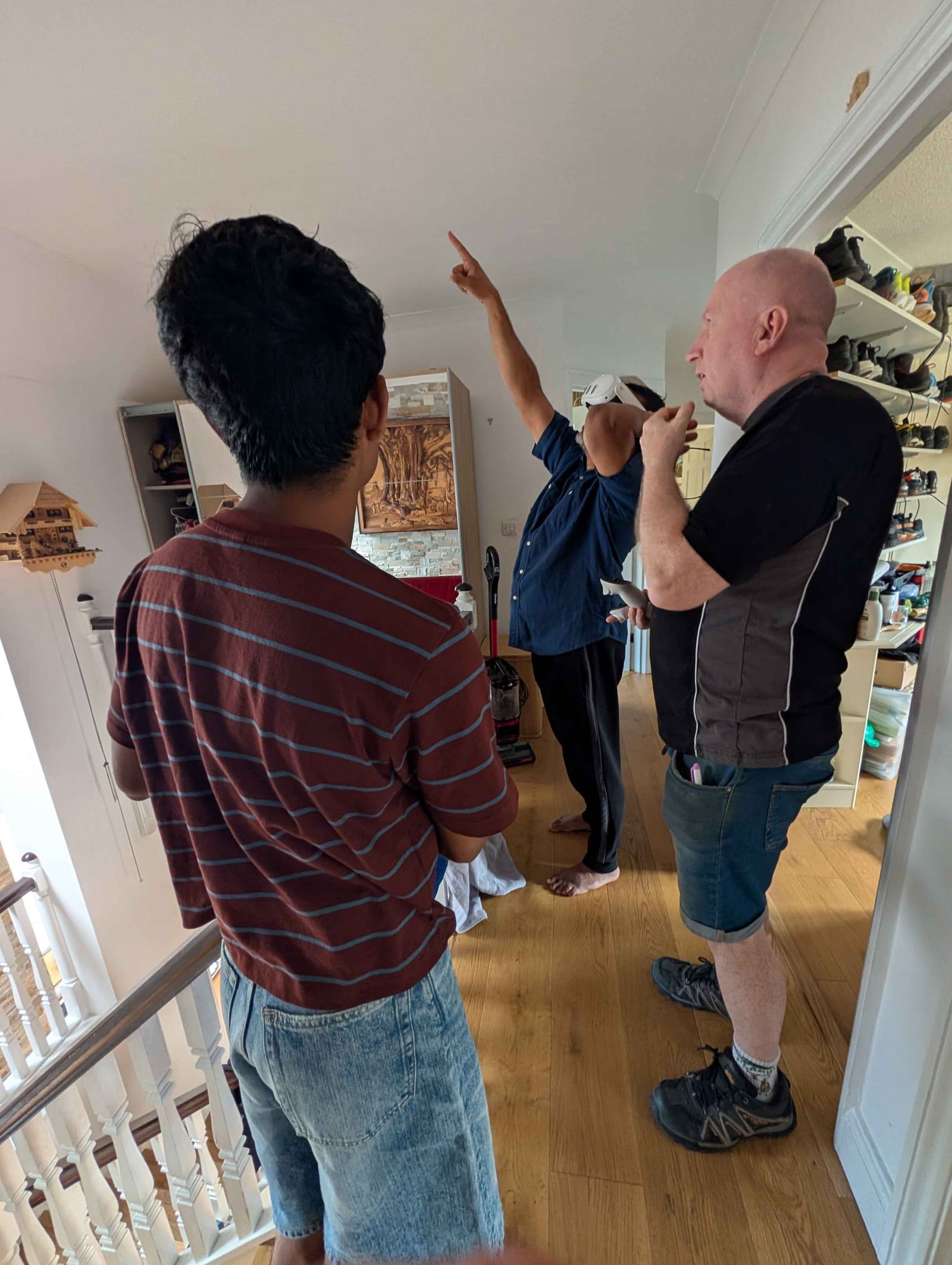 Homeowner wearing a Meta Quest headset, viewing the planned loft conversion at 1:1 scale